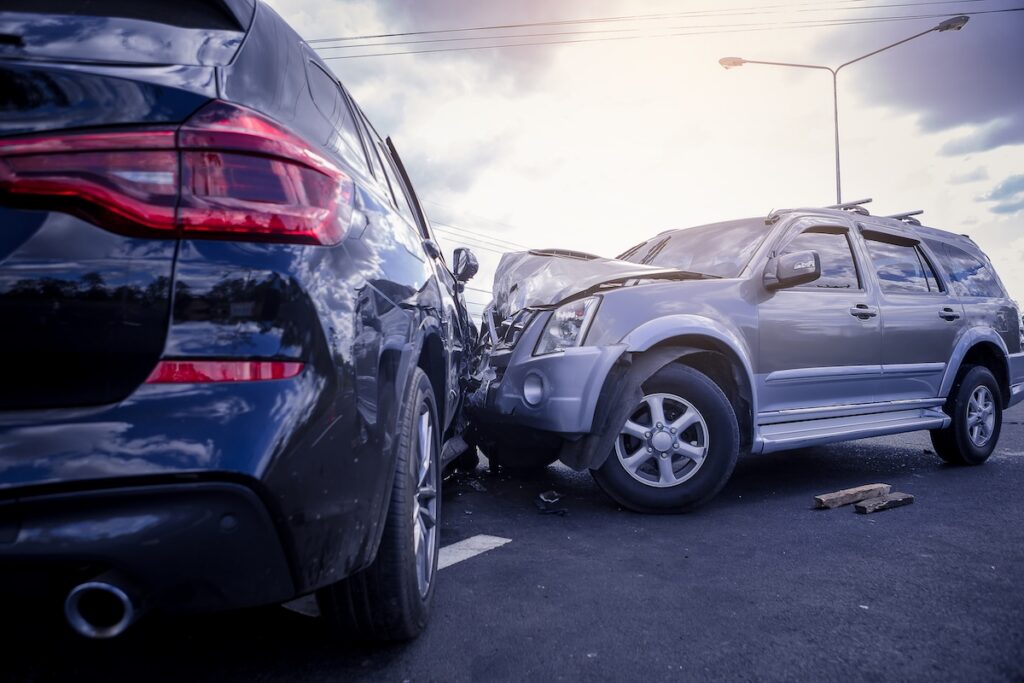 Side-collision of silver and blue SUVs