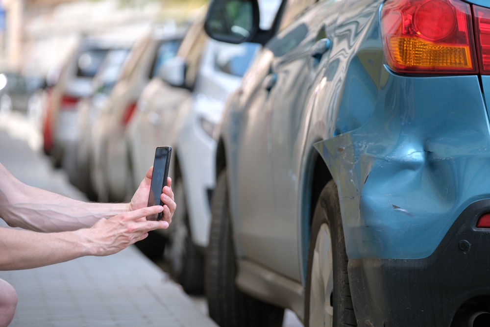 Taking picture of damage to a car after an accident